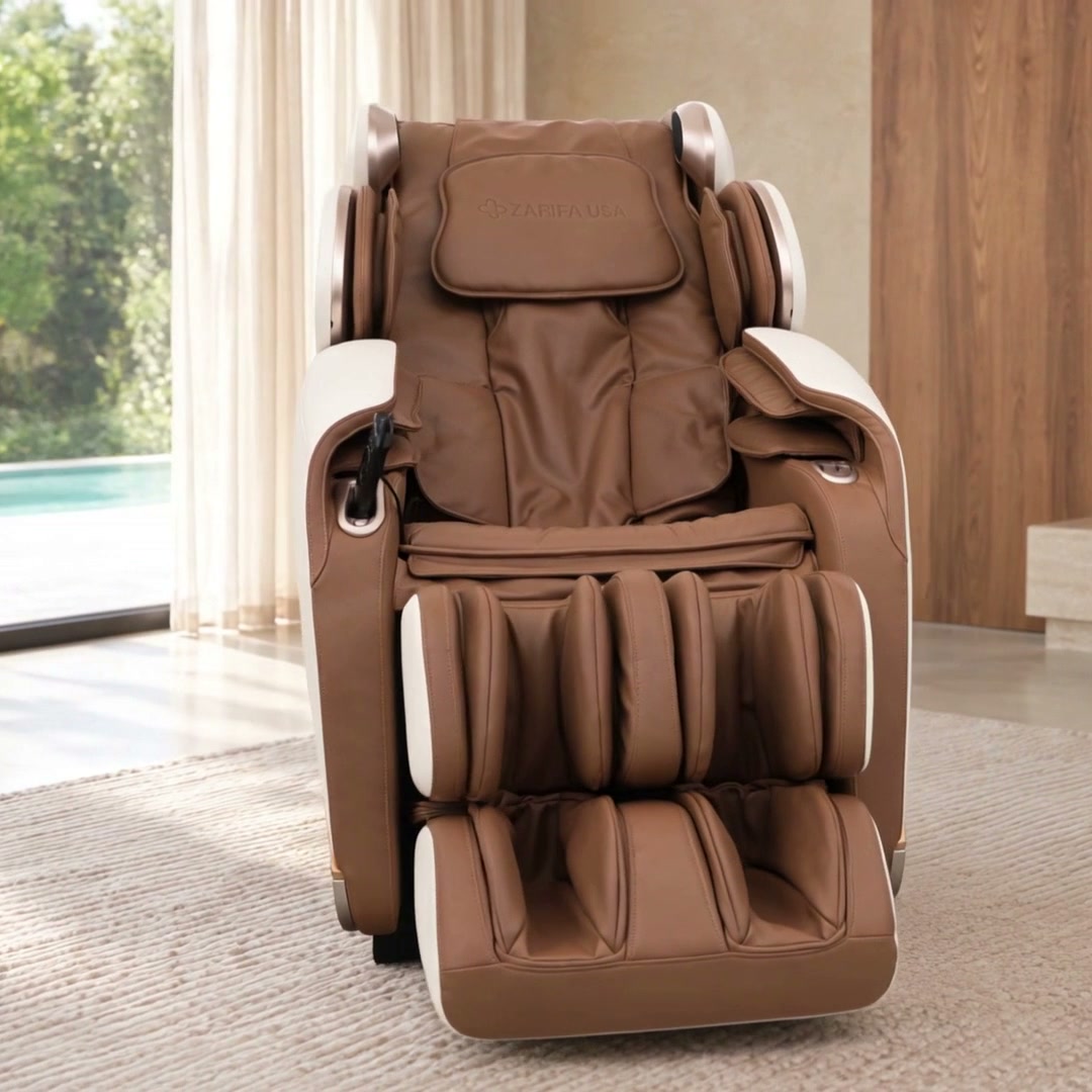 Zarifa Z-Dream massage chair with ivory panels and caramel upholstery in a bright luxury room, shown upright from multiple angles with close-ups of the arm controls and stamped pillow logo.