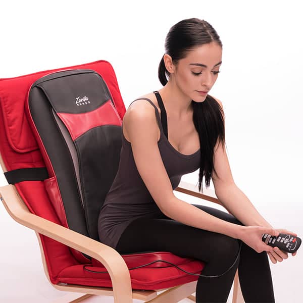 Classic Cushion - Shiatsu Massage Cushion for Chair with Heated Nodes, Targeted Back Massage, Class 1 Medical Device, HSA/FSA Approved, and Convenient Remote Control sitting in chair